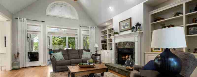 Spacious and elegant living room featuring a stylish fireplace, neutral tones, and ample natural light., tags: kleine aus - pexel